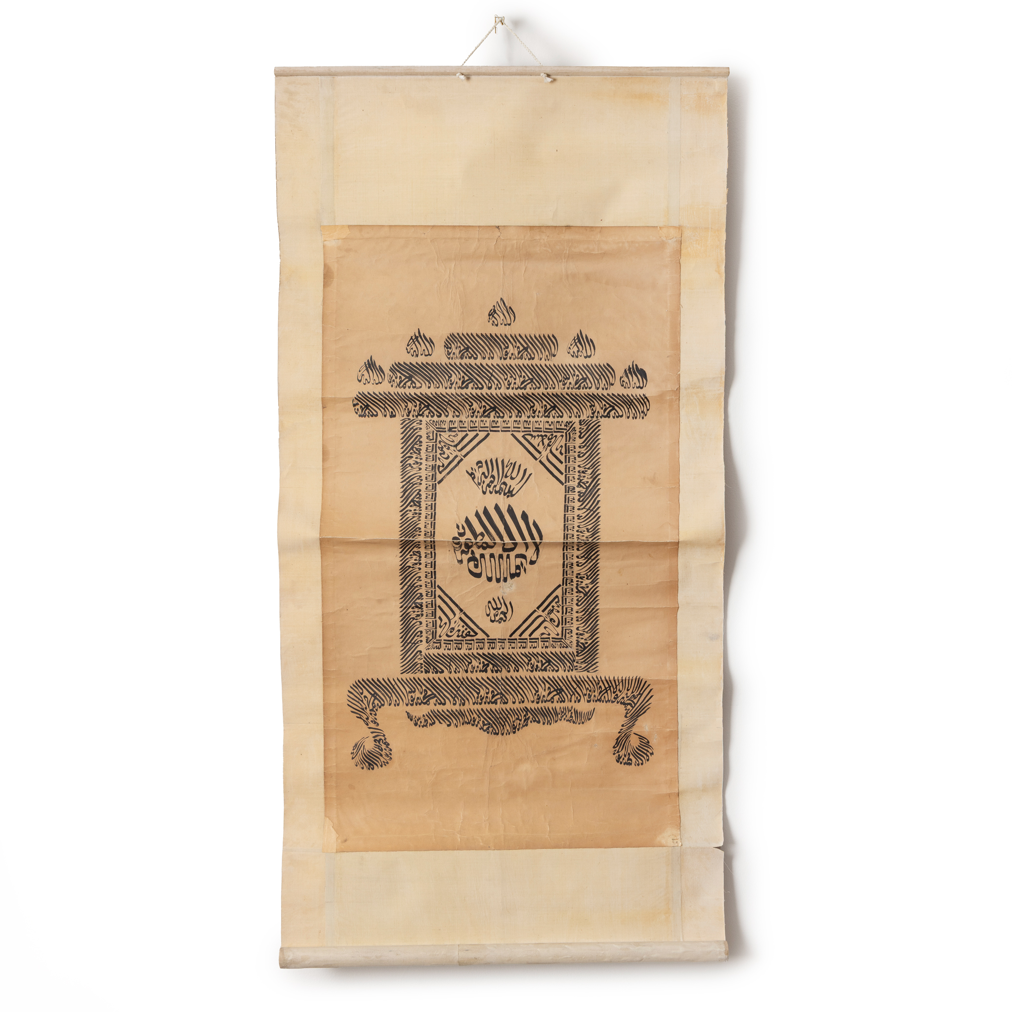 A SCROLL WITH STYLISED ARABIC CALLIGRAPHY