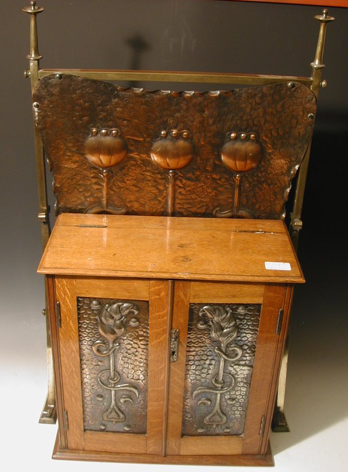 An Art Nouveau oak smoker's cabinet,