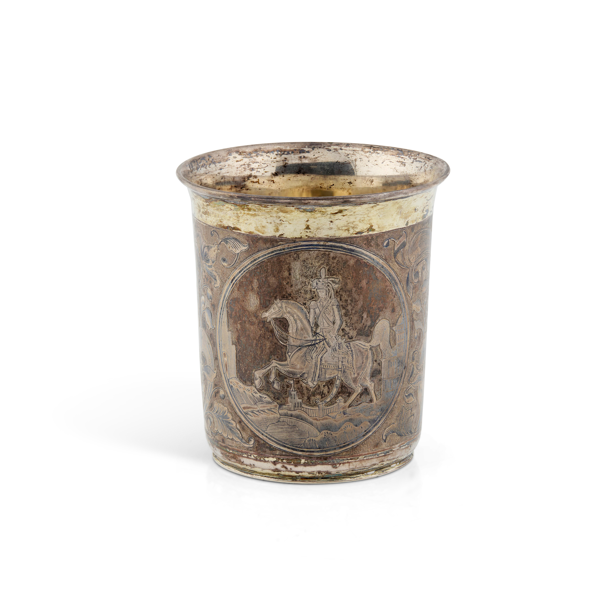 A 19TH CENTURY RUSSIAN PARCEL-GILT AND NIELLO BEAKER