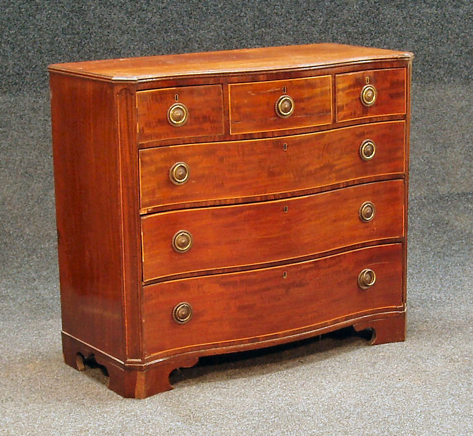 A Georgian mahogany serpentine chest,