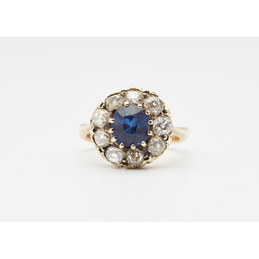 AMENDMENT - A synthetic sapphire and diamond set cluster ring