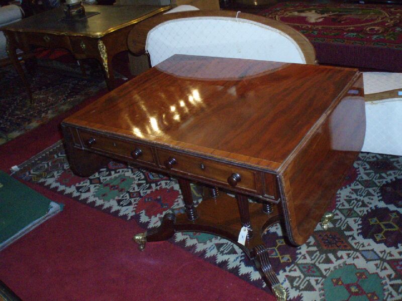 A 19th century mahogany and tulipwood cross-banded sofa table