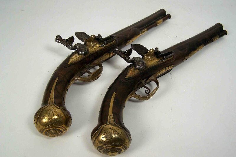 A pair of early 18th century continental flintlock belt pistols