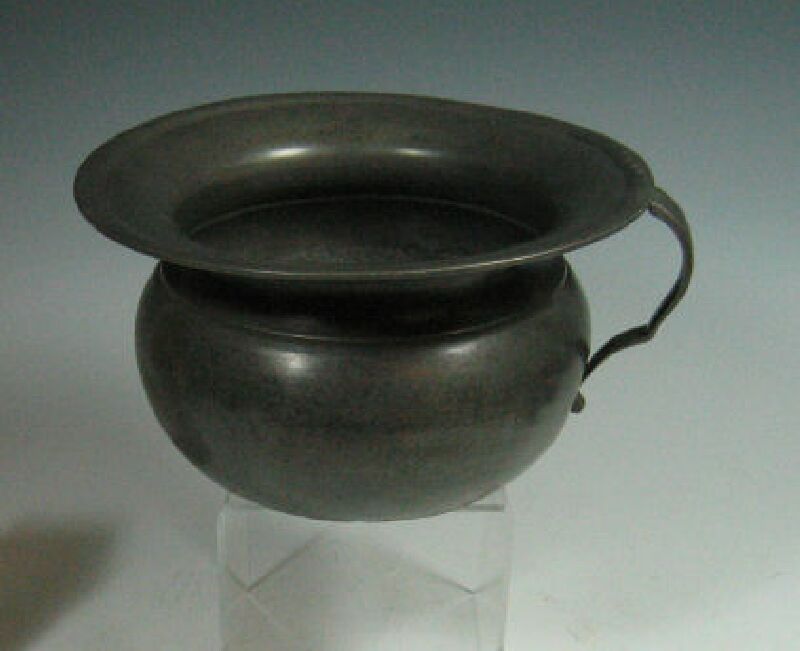 An 18th century pewter chamber pot