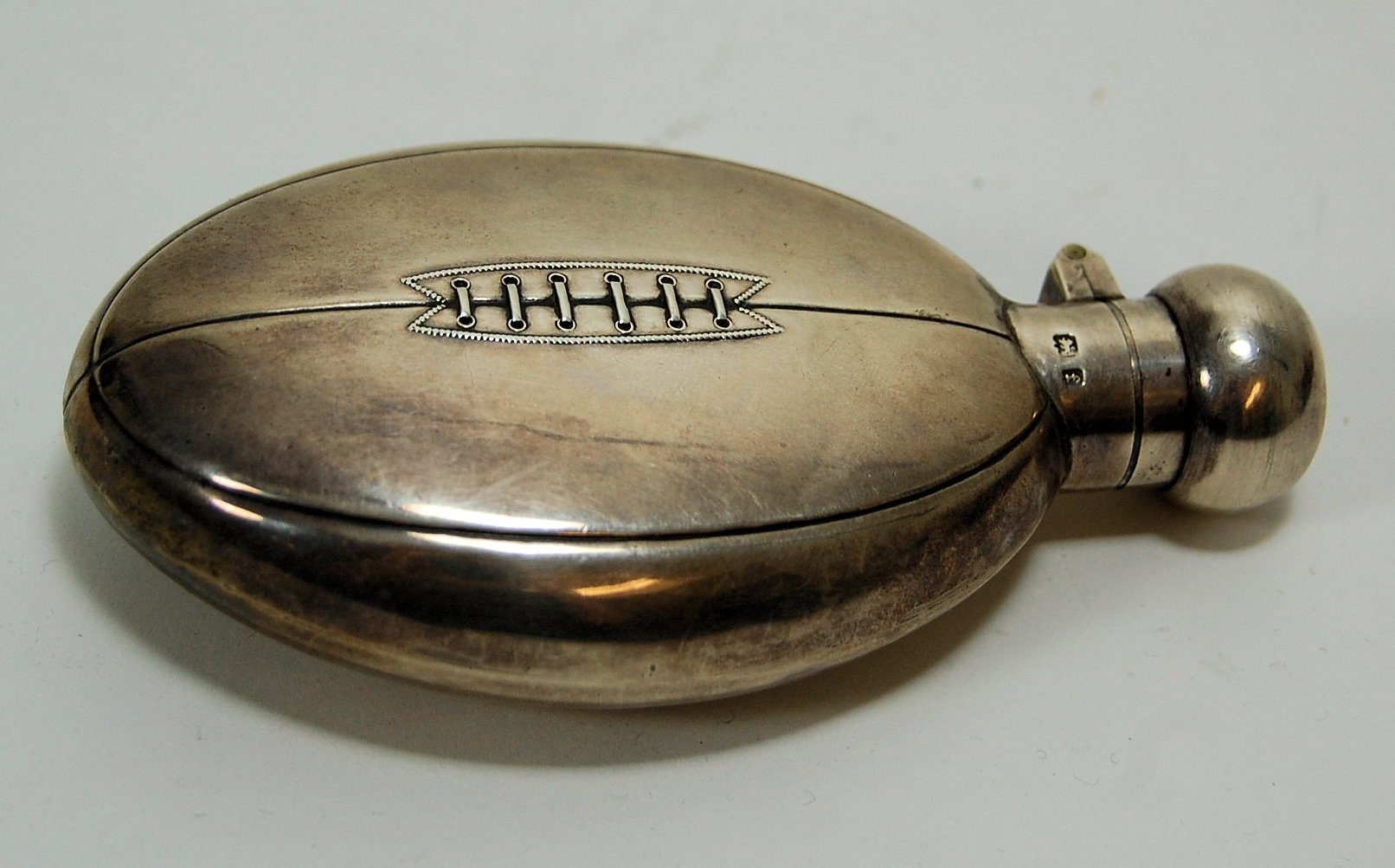 A novelty rugby ball hip flask
