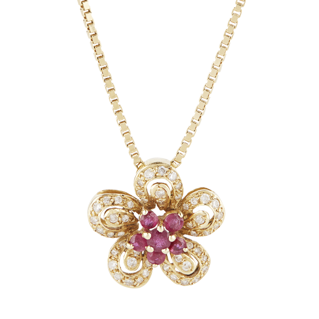 A ruby and diamond set floral pendant