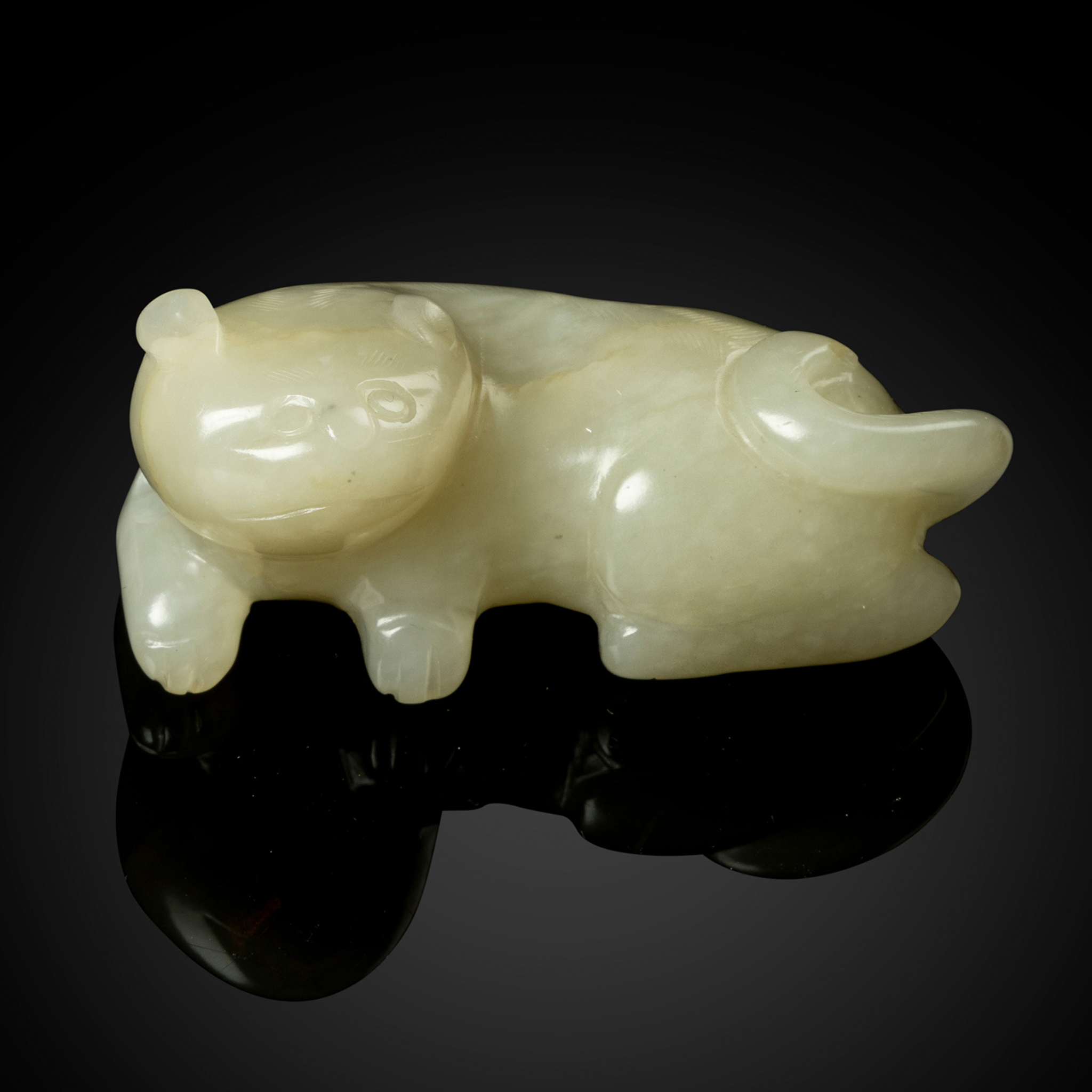 CHINESE PALE CELADON JADE CARVING OF A BADGER (HUAN)