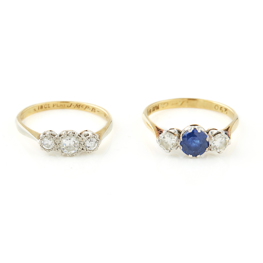 A sapphire and diamond set three stone ring