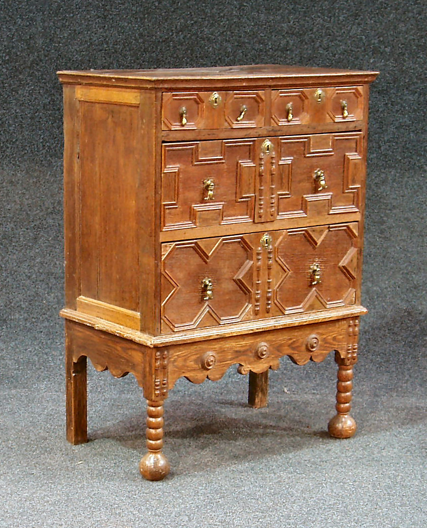 A 17th century style oak chest on stand
