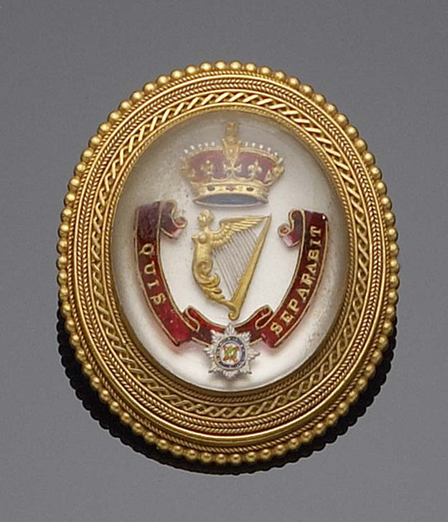 Irish Regimental Interest - a gold mounted oval brooch,