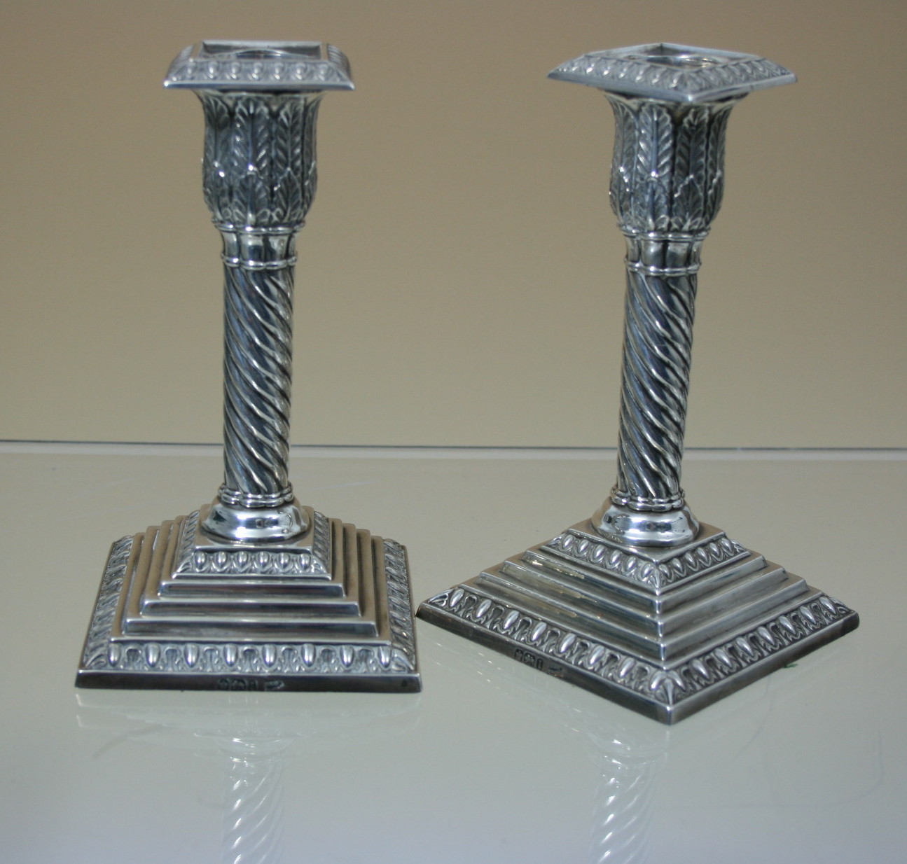 A pair of dwarf silver table candlesticks