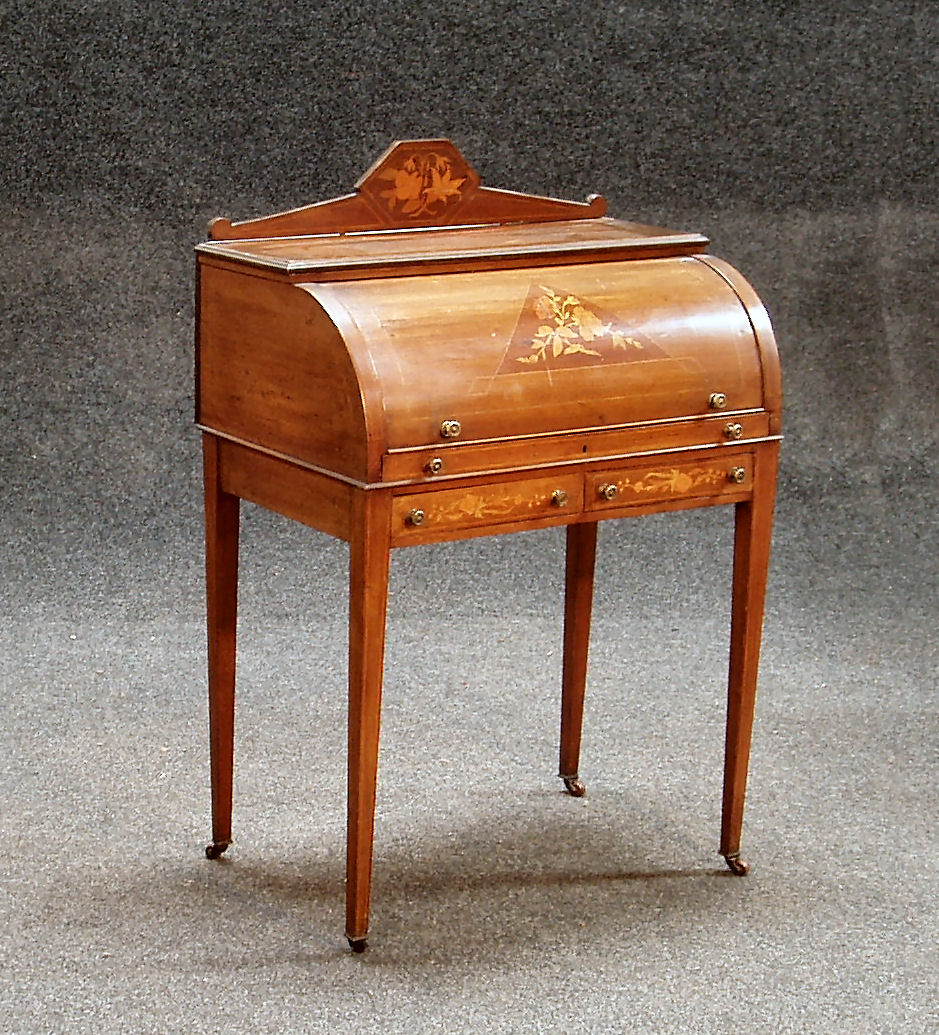An Edwardian mahogany cylinder desk