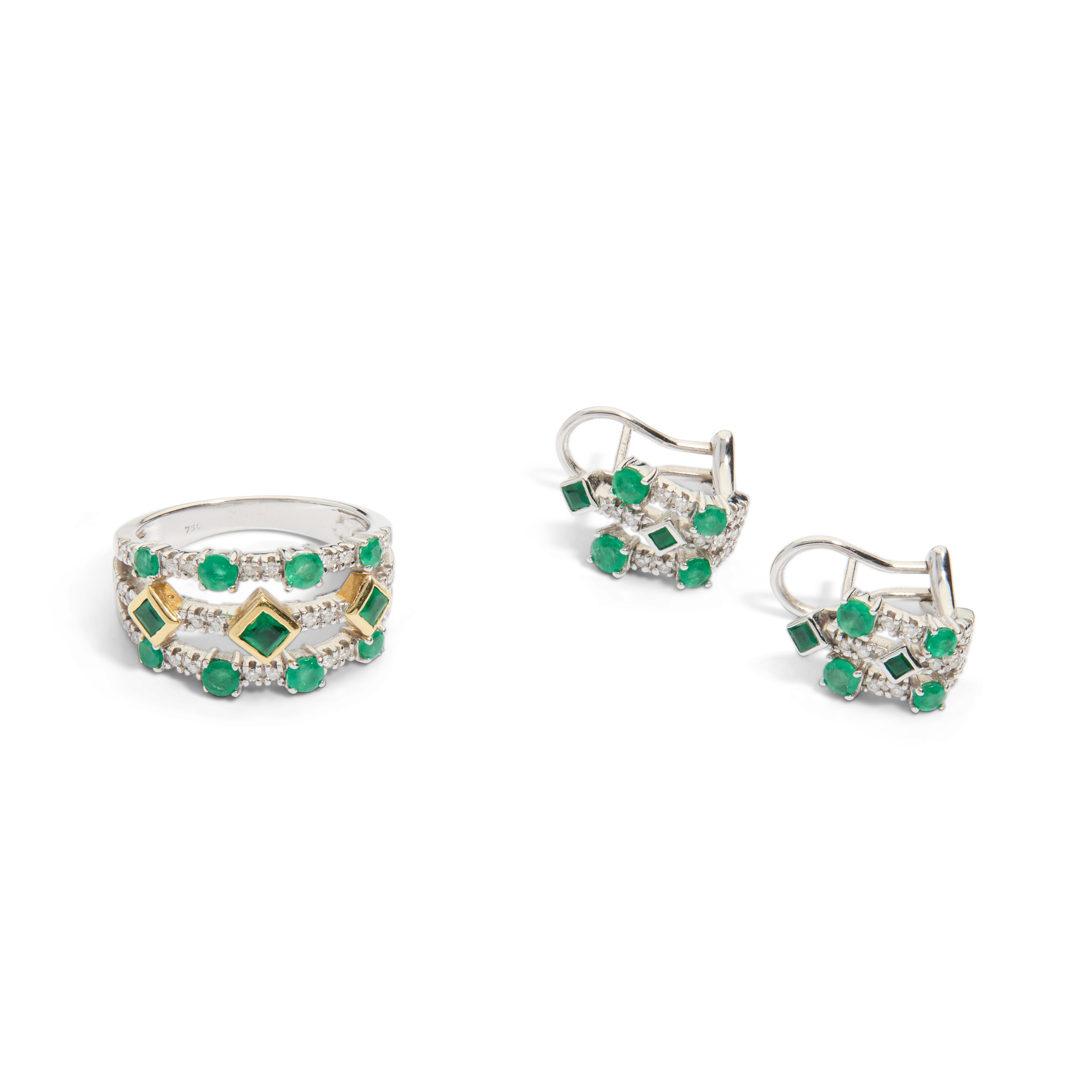 An emerald and diamond ring and matching earrings