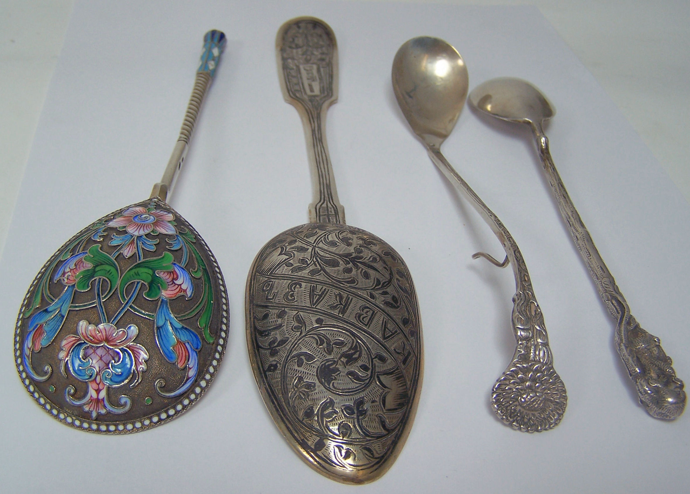 A group of four Russian spoons