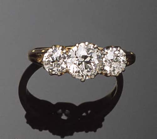 An 18ct gold mounted diamond three stone ring,