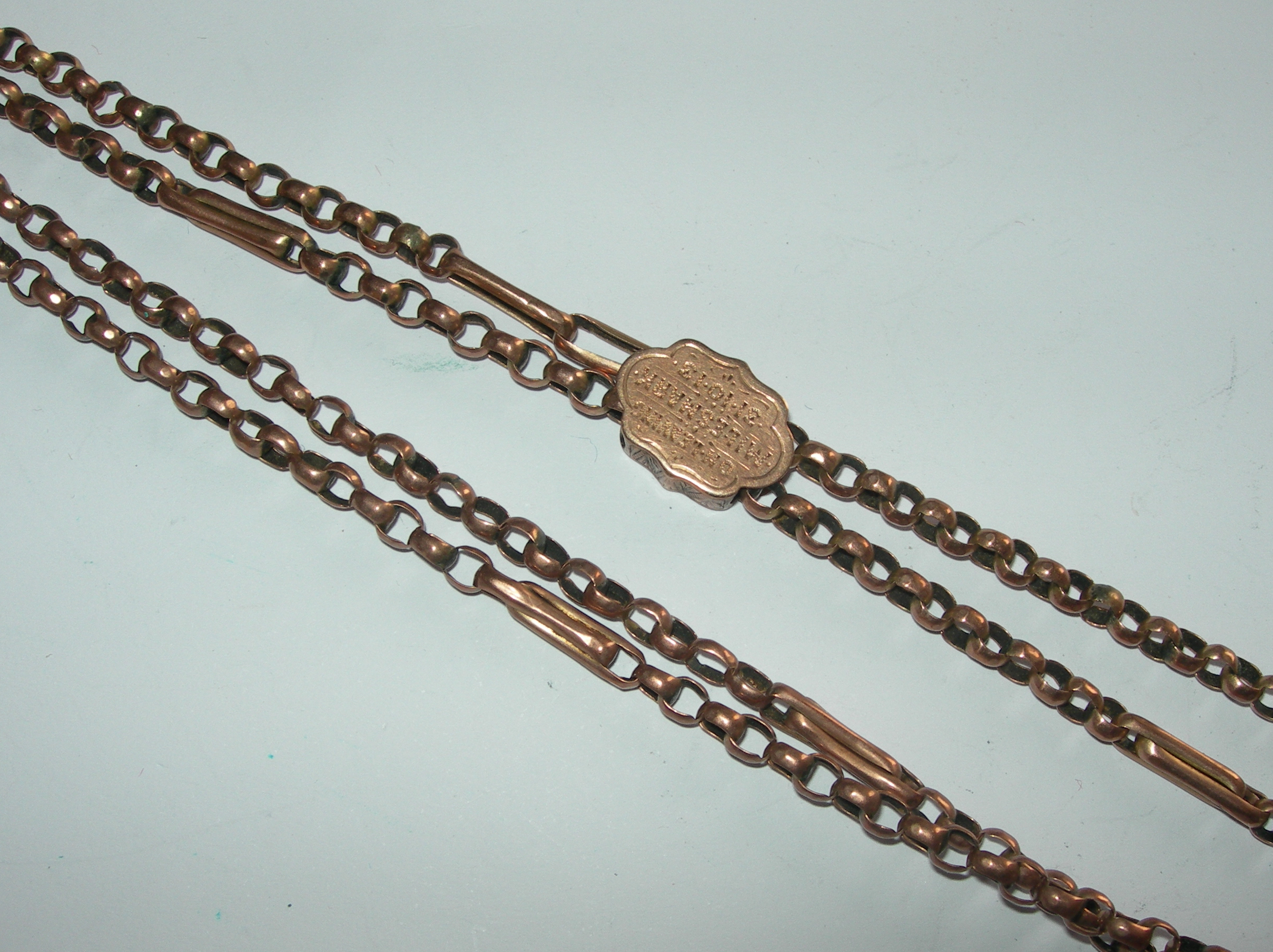 A 9ct rose gold long chain,