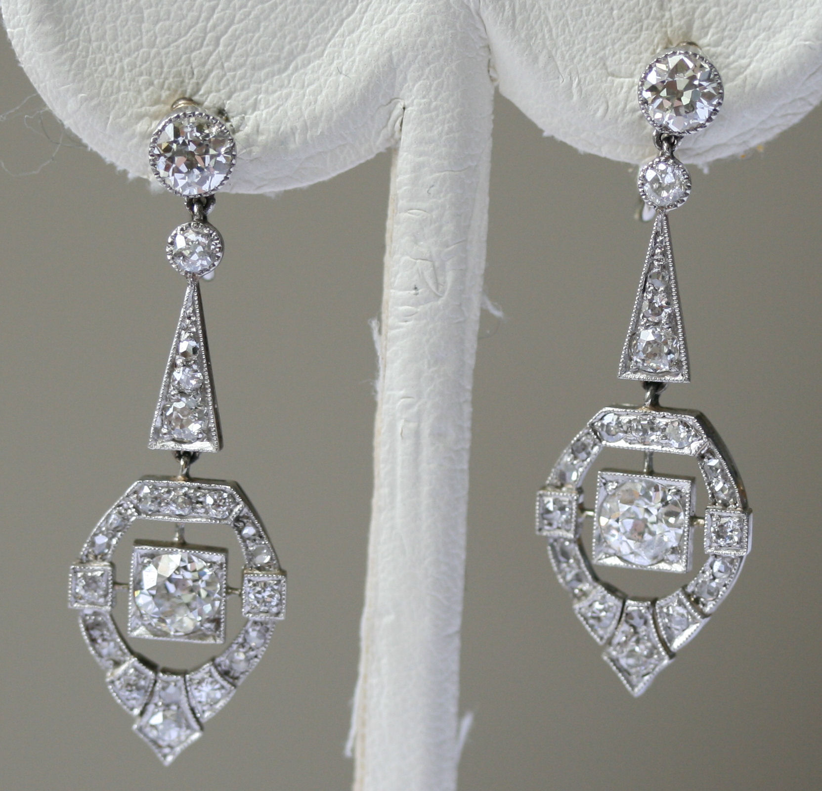 A pair of Art Deco diamond set pendant earrings