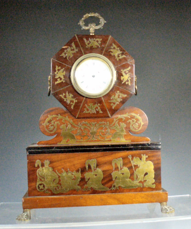 A Regency mahogany and brass inlaid mantel clock