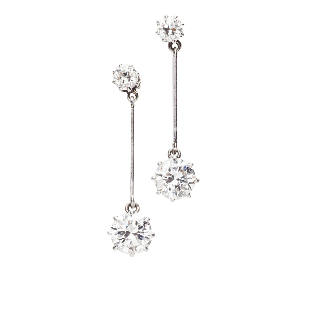 An early 20th century pair of diamond set ear pendants