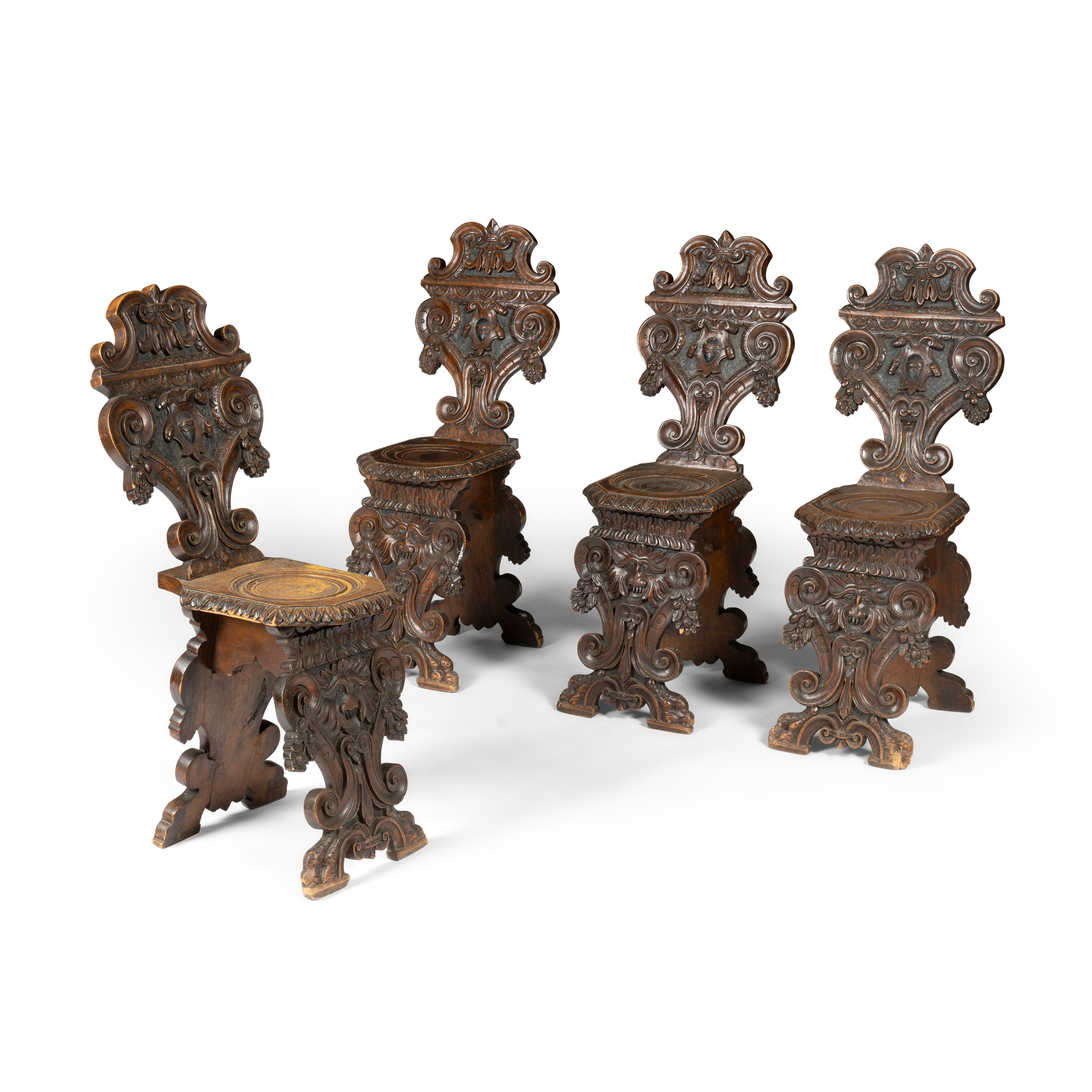 A SET OF FOUR ITALIAN WALNUT SGABELLO HALL CHAIRS