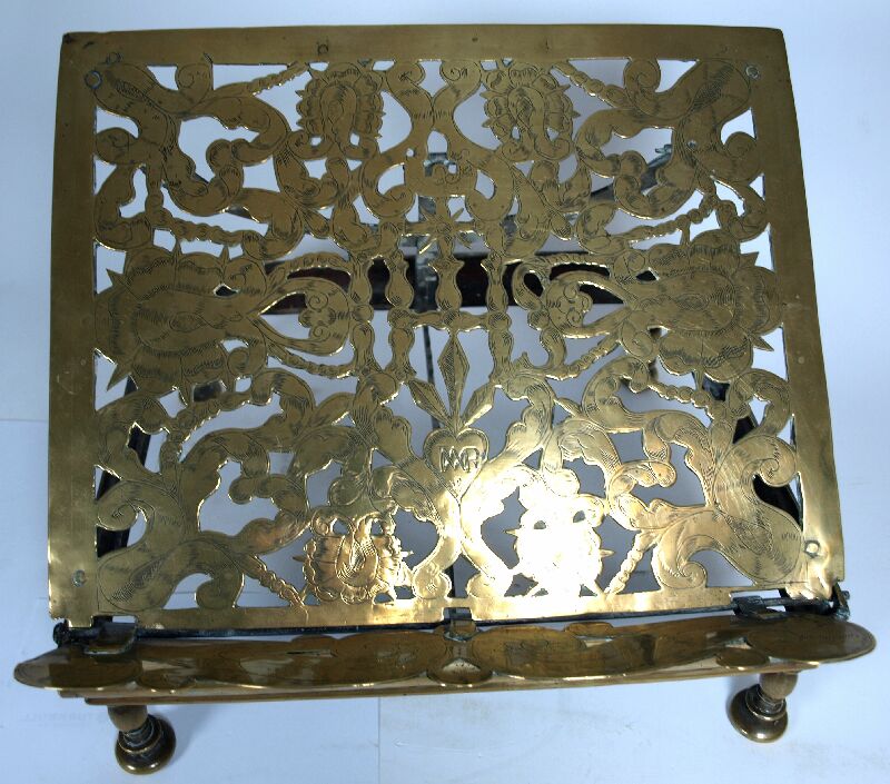 A late 17th/ early18th century Dutch engraved brass book stand