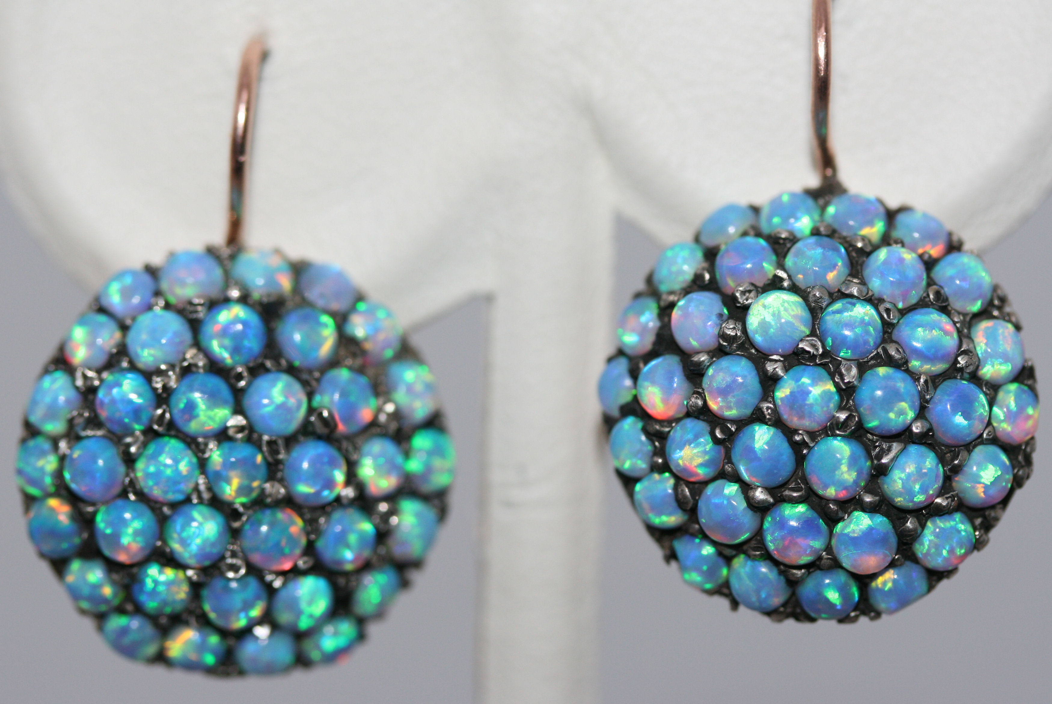 A pair of opal cluster earrings