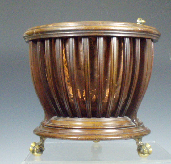 An Edwardian mahogany slatted coal bin