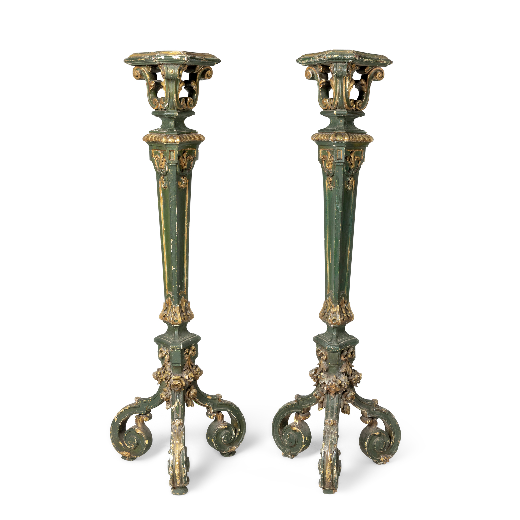 A PAIR OF GREEN PAINTED AND GILT DECORATED TORCHERES