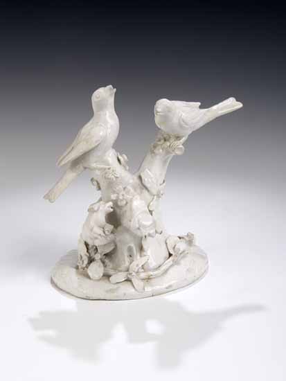 A Bow figure of birds and branches