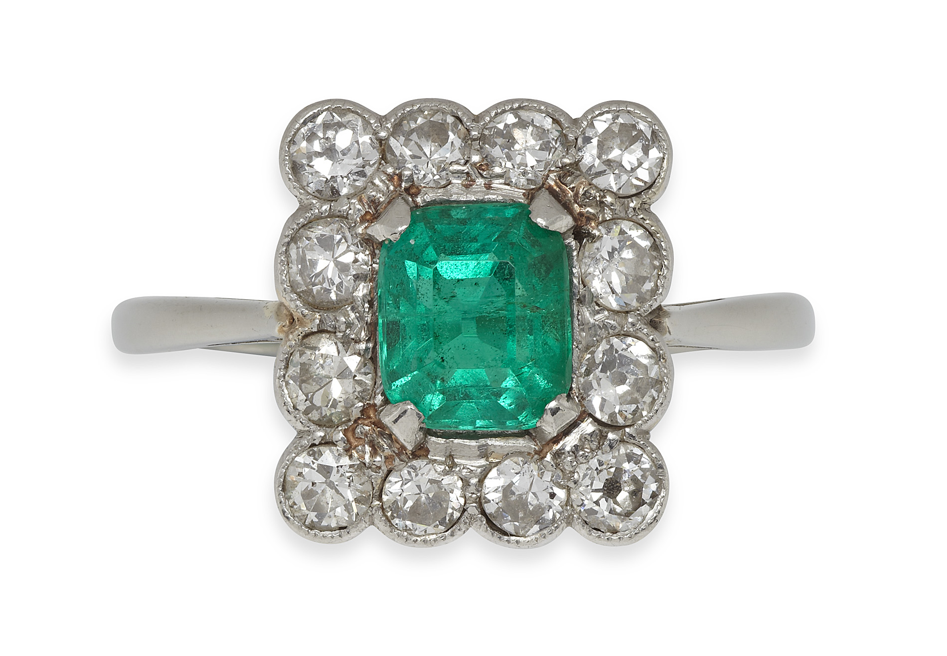 An early 20th century emerald and diamond set ring