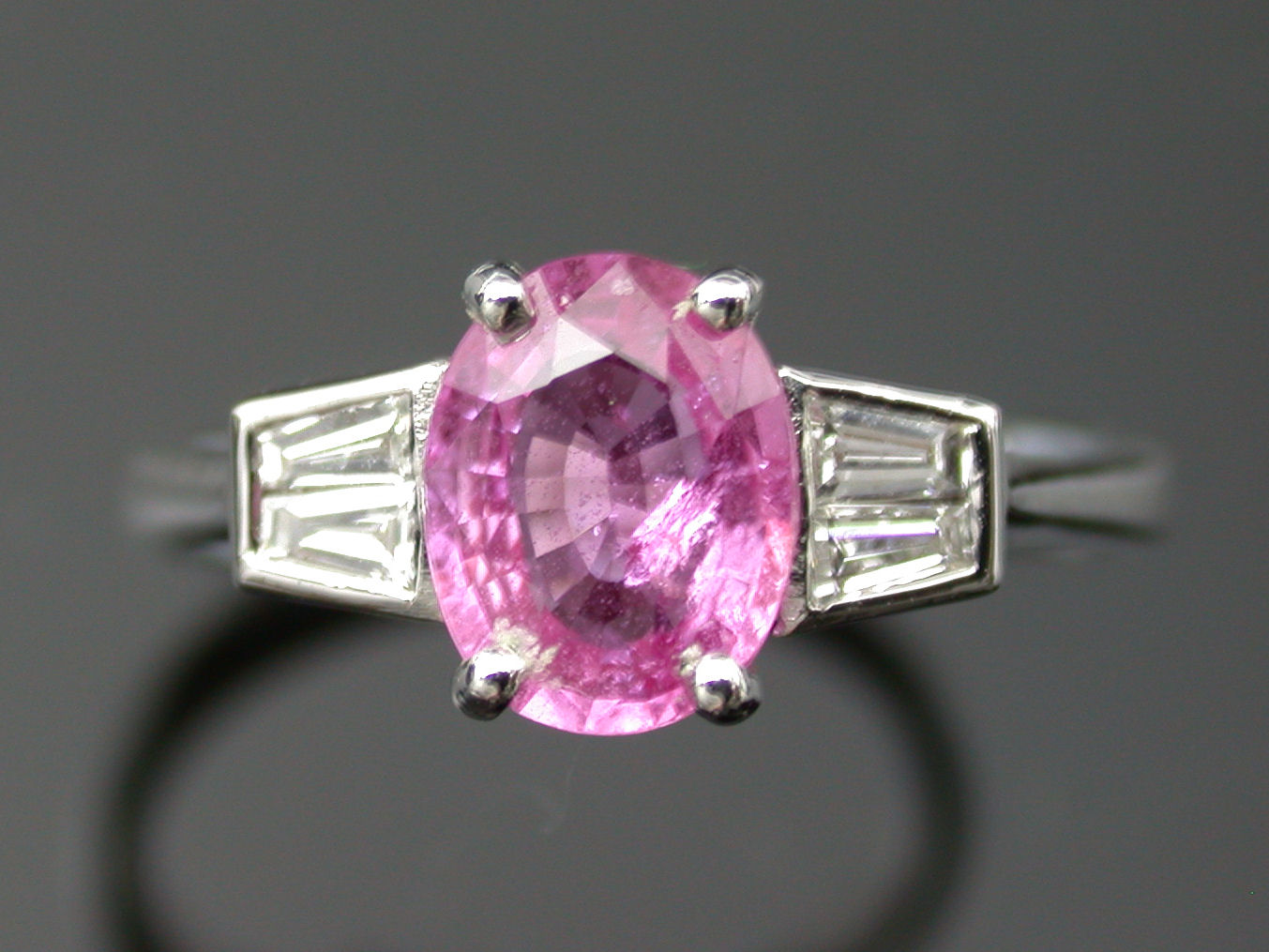 A pink sapphire and diamond ring,