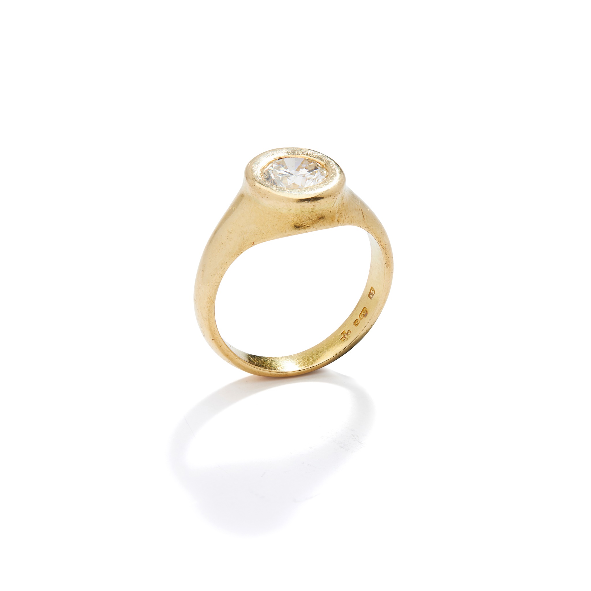 A diamond single-stone ring in 18ct yellow gold