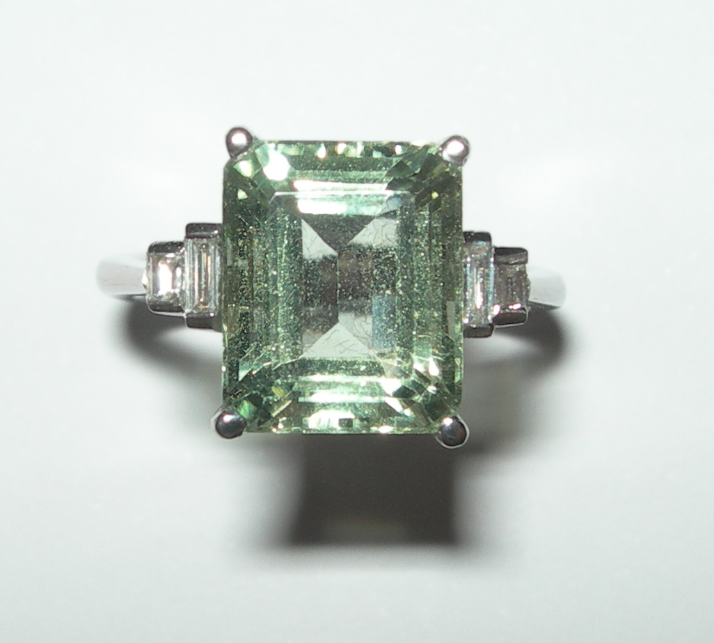 An unusual green quartz and diamond set ring,