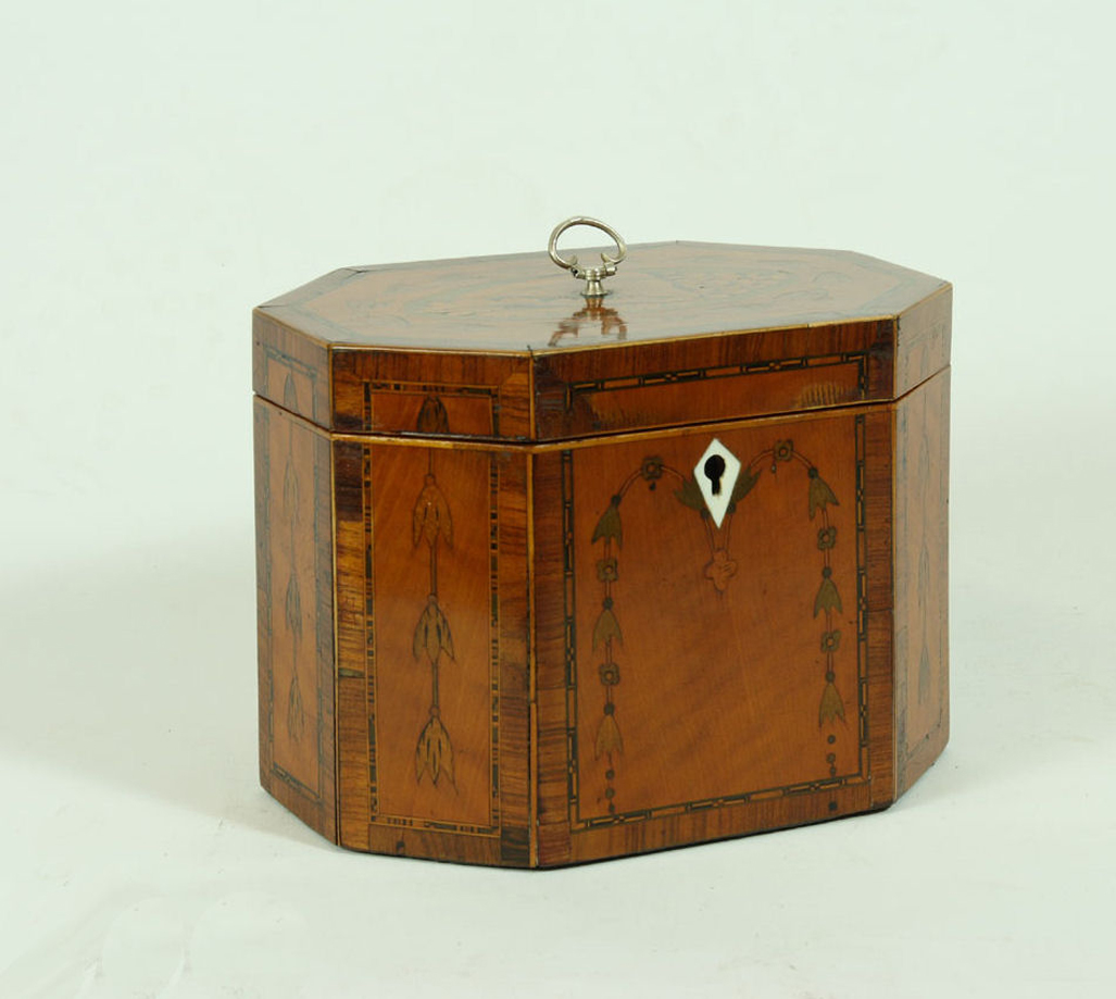 A George III octagonal mahogany tea caddy
