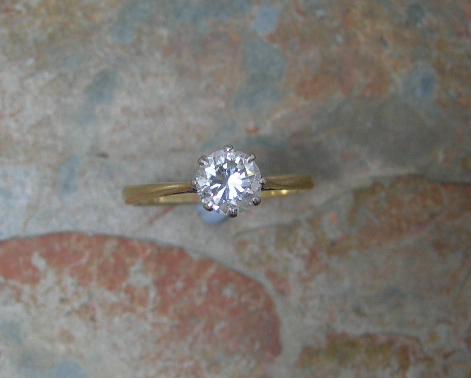 An 18ct gold mounted diamond single-stone ring,