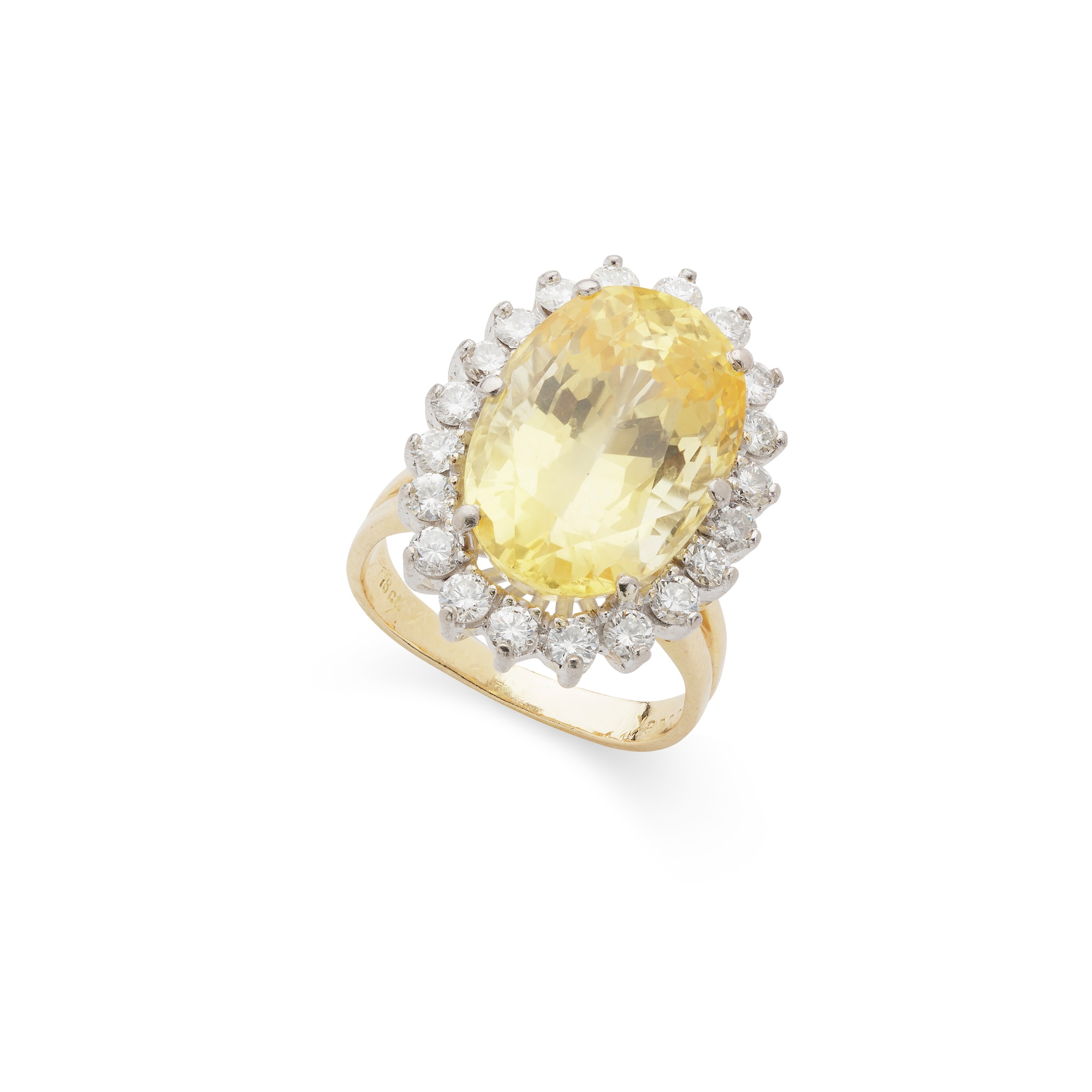 A yellow sapphire and diamond cluster ring
