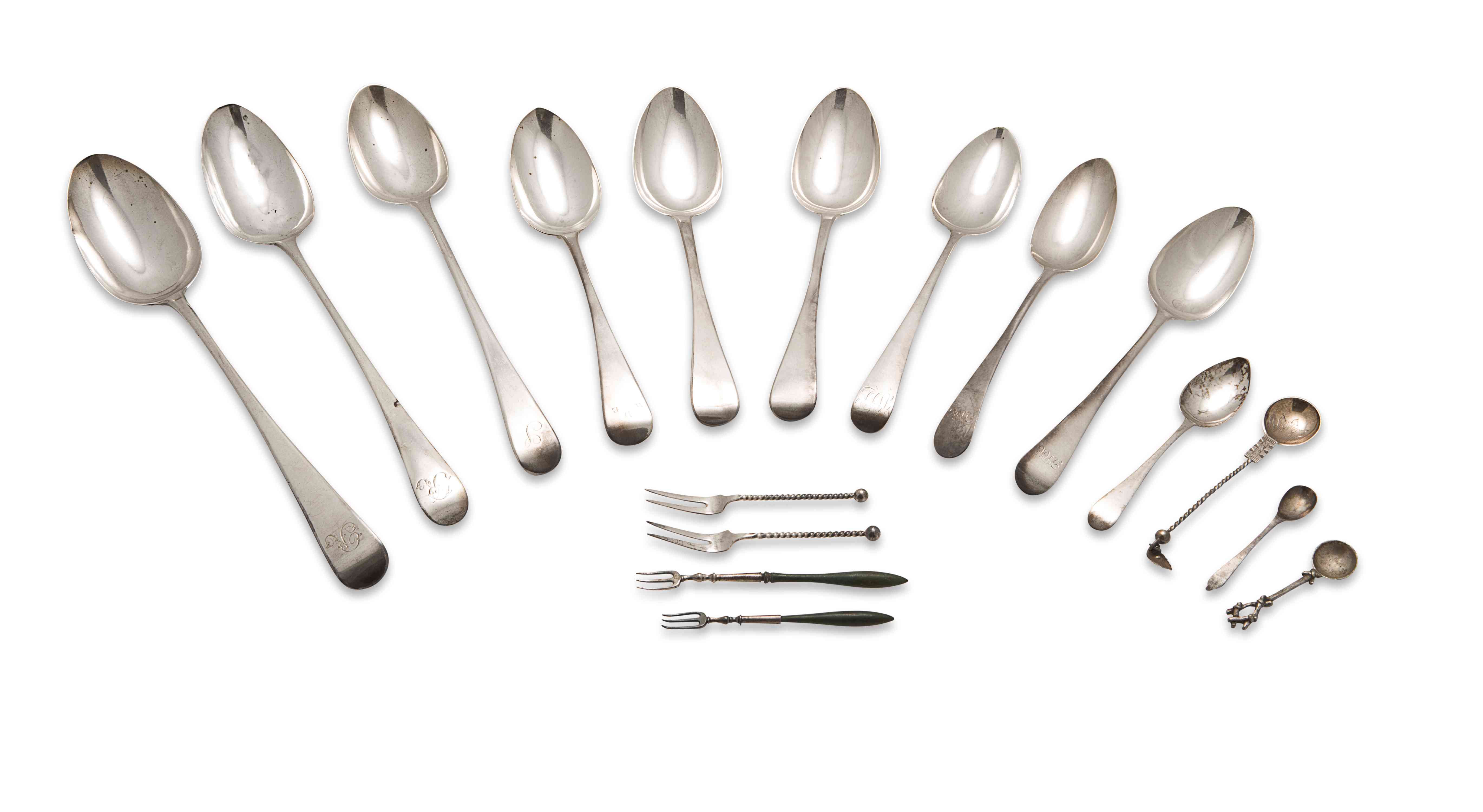 A group of silver flatware