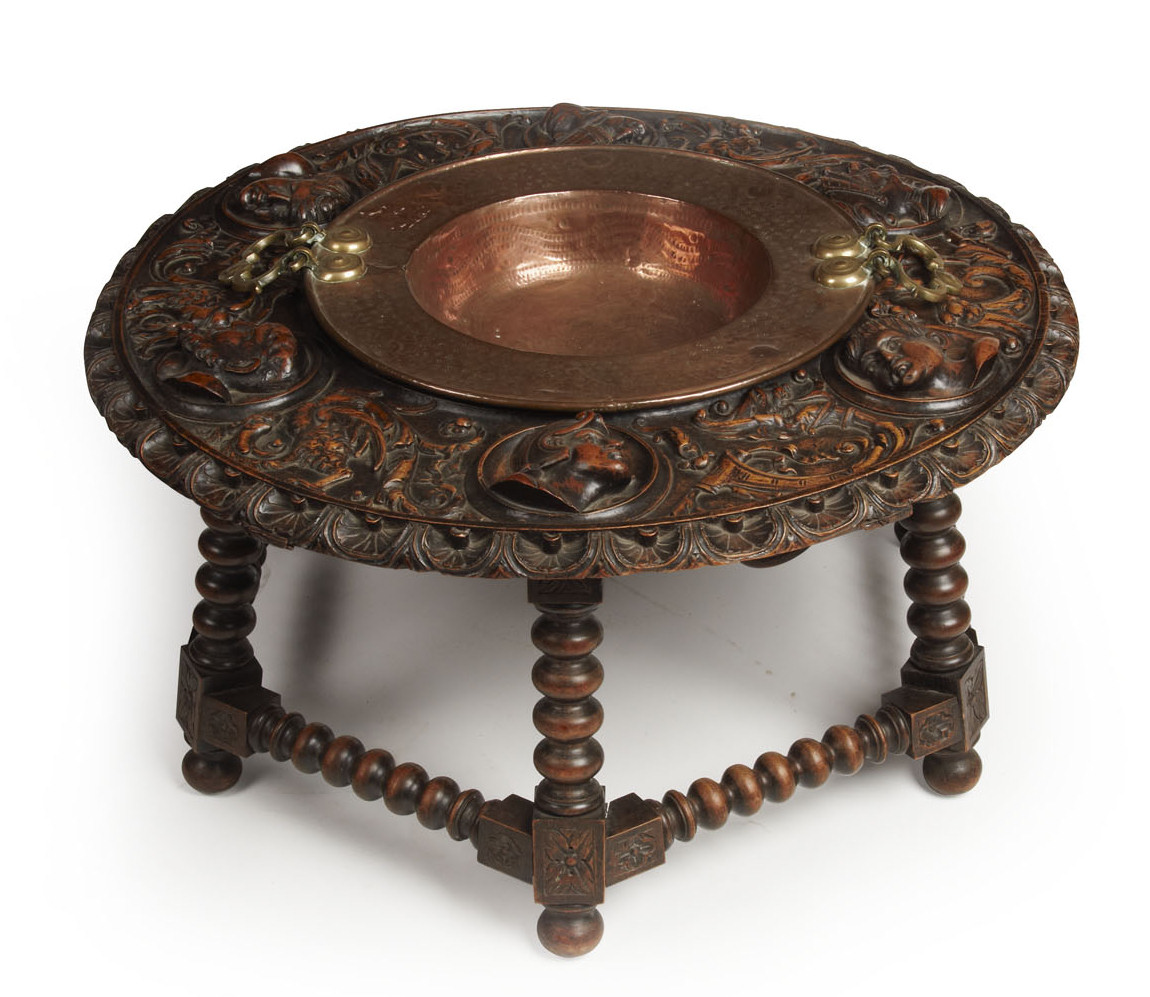 A 19th century heavily carved oak table