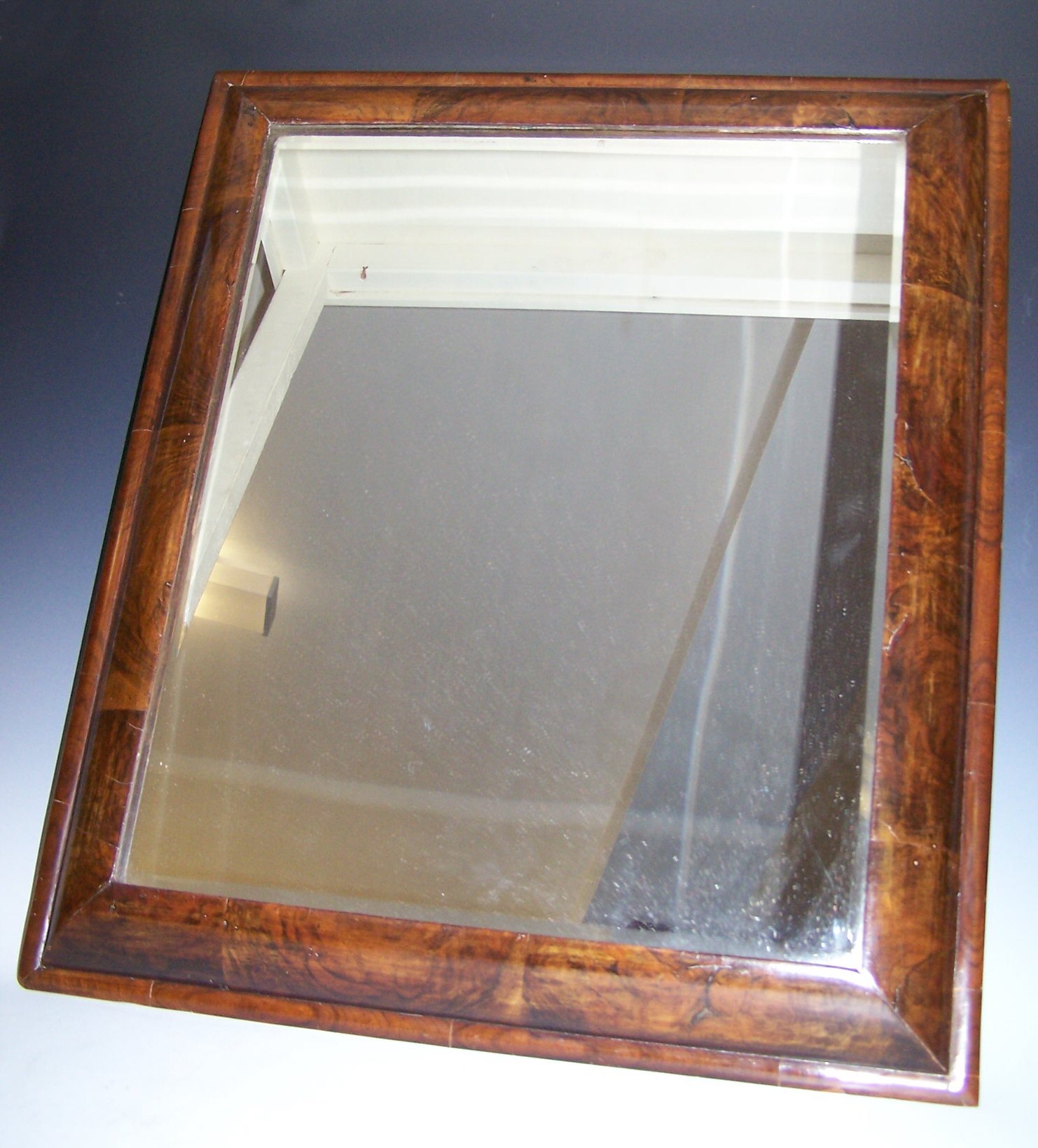A late 17th century walnut framed wall mirror