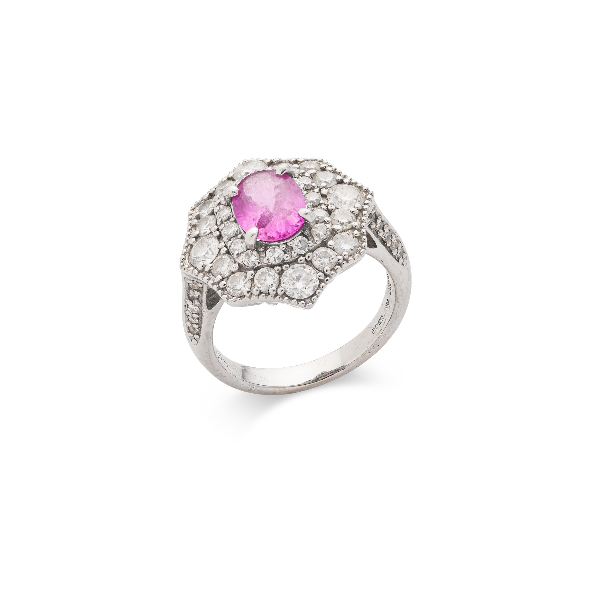 A pink sapphire and diamond dress ring