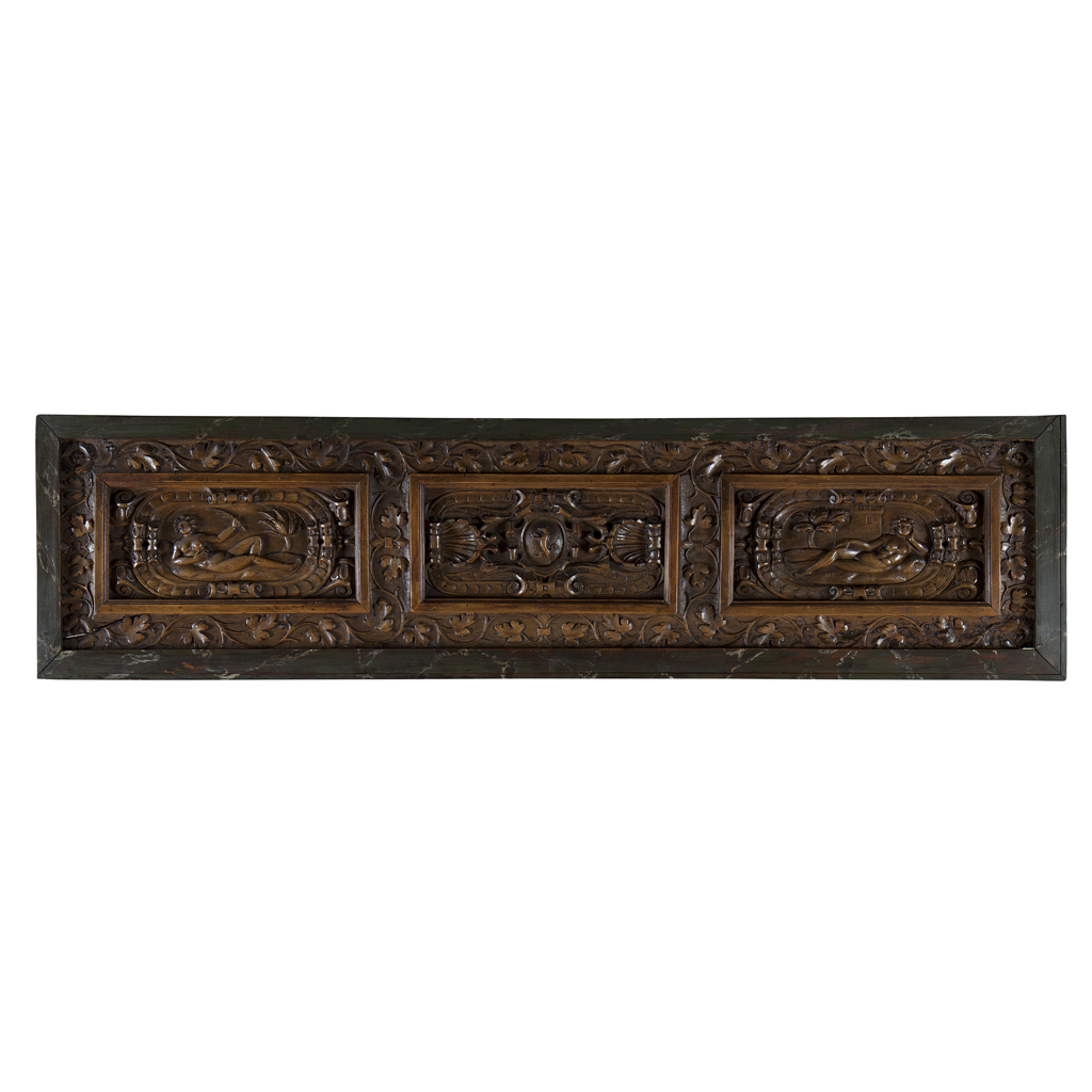 A FRENCH OR NORTH ITALIAN CARVED WALNUT PANEL