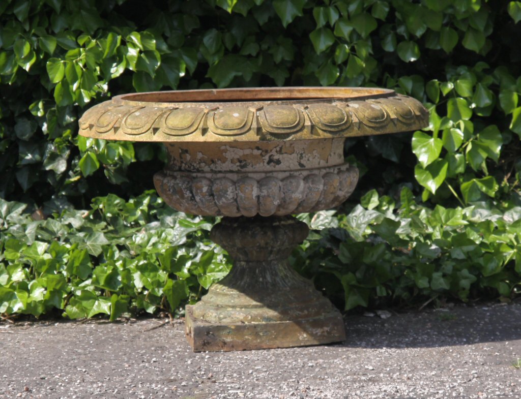 A large terracotta garden urn
