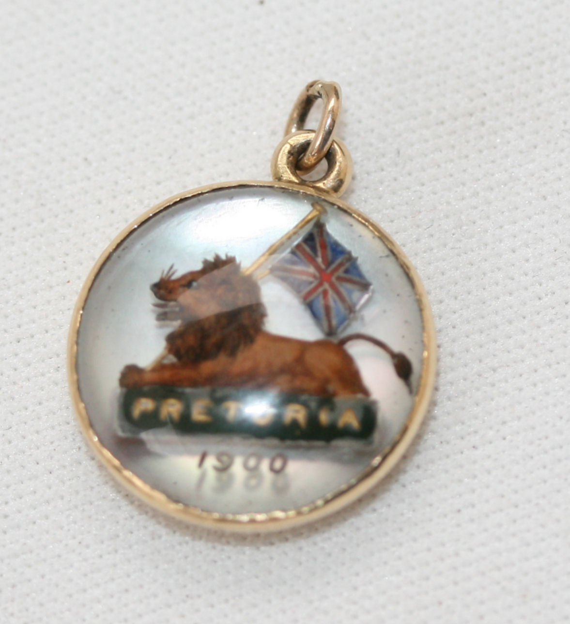 A late Victorian commemorative hand-painted reverse crystal intaglio set pendant