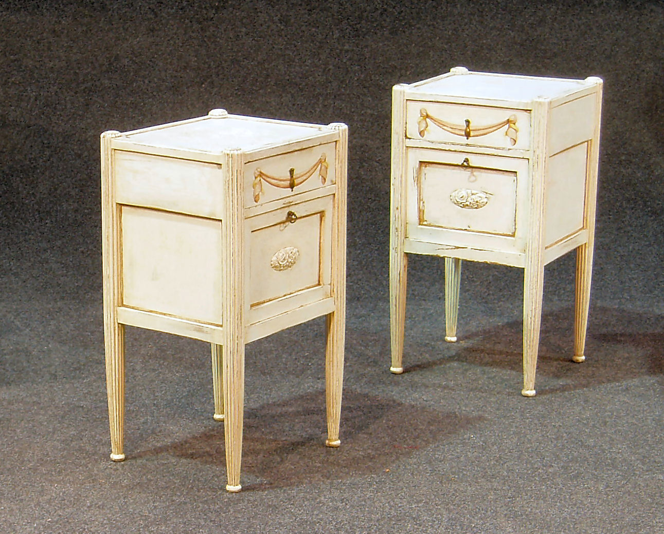 A pair of French style white painted bedside commodes