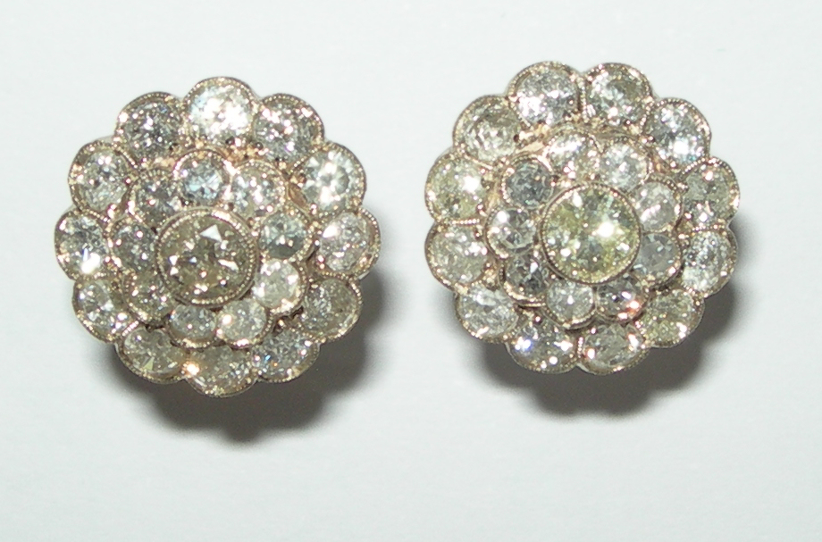 A pair of diamond floral cluster earrings,