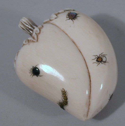 A Japanese carved ivory shibyama decorated plump bean