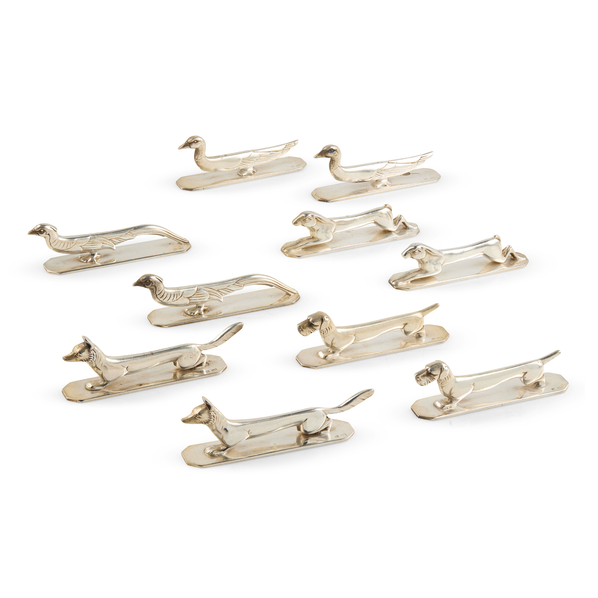 A SET OF TEN EARLY 20TH CENTURY FRENCH SILVER-PLATED HUNTING KNIFE RESTS