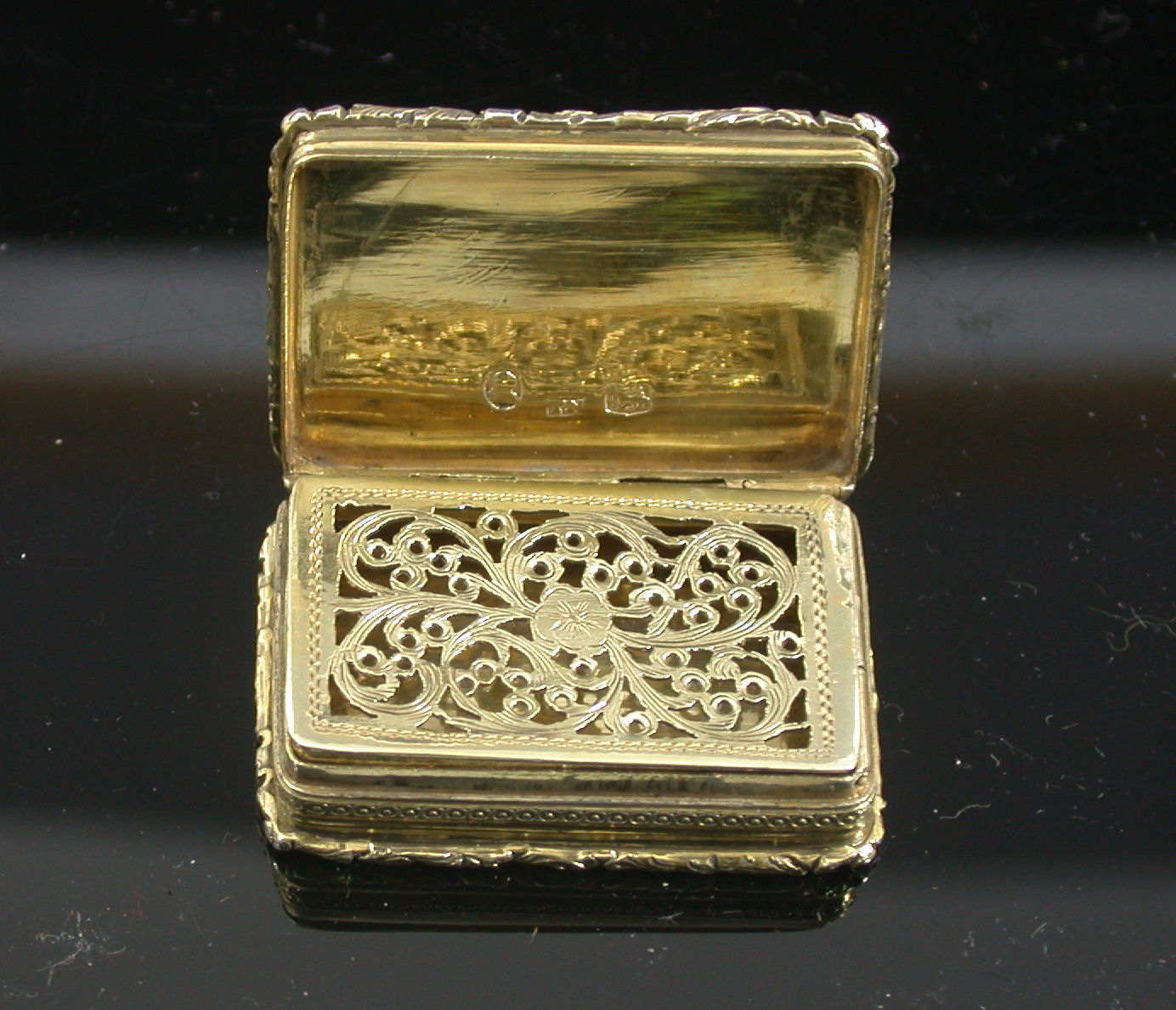 A George III silver gilt vinaigrette,