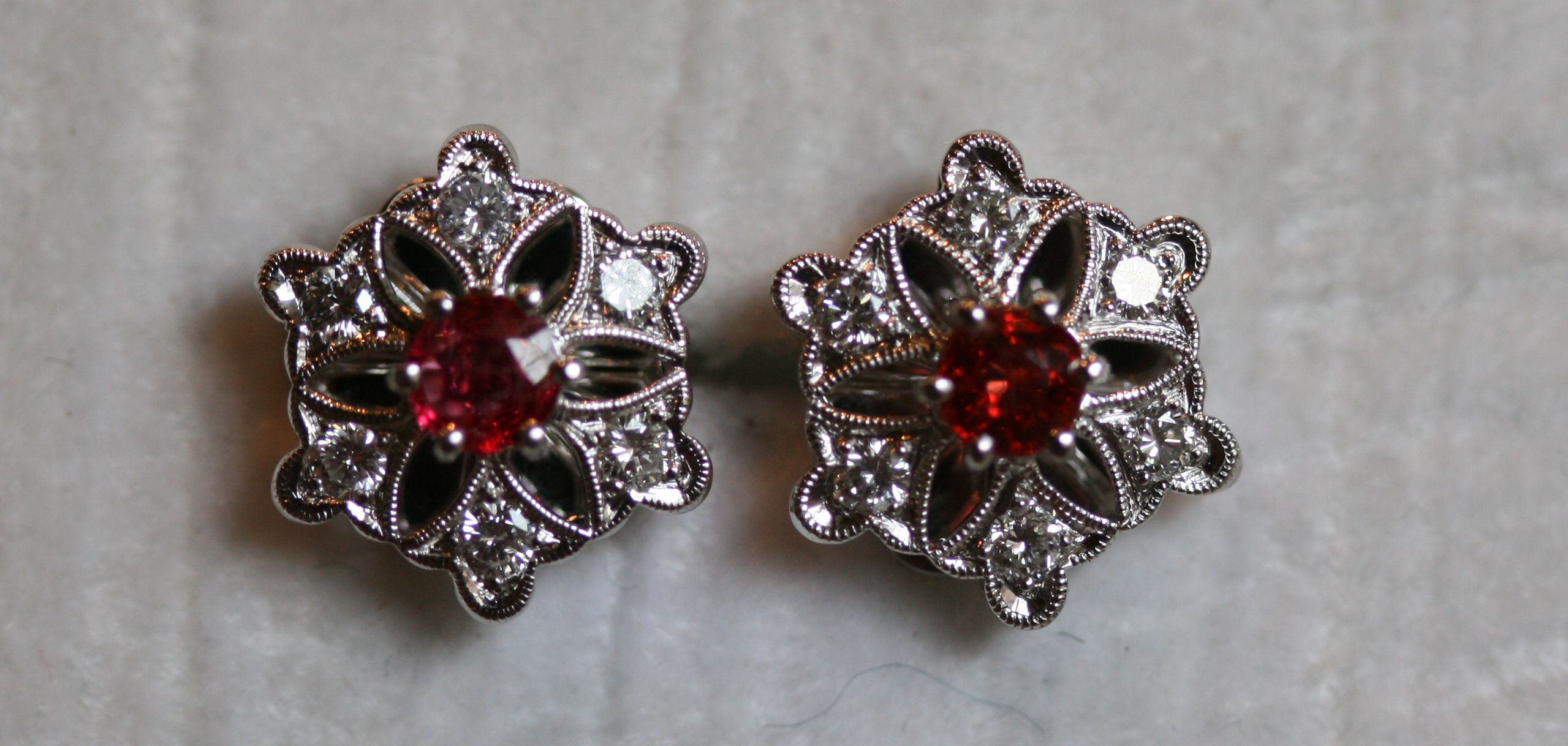 A pair of contemporary ruby and diamond cluster earrings