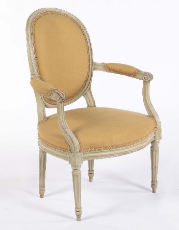 A 19th century style painted beechwood fauteuil In the Louis XVI style
